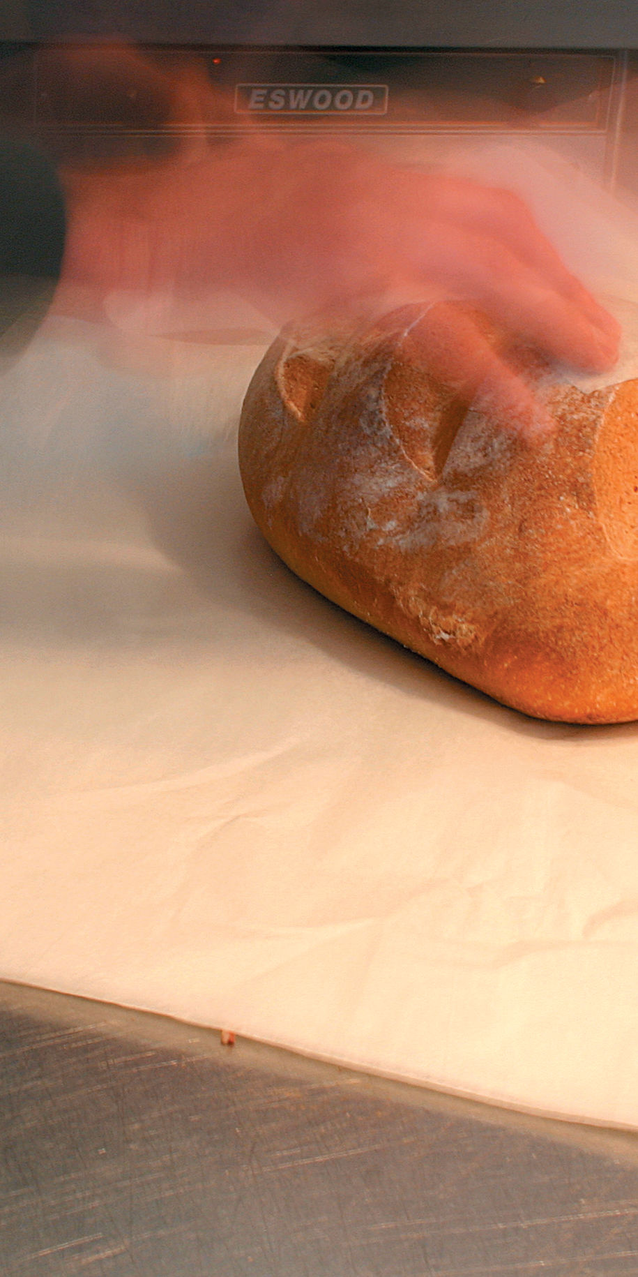 Slicing freshly baked bread.
